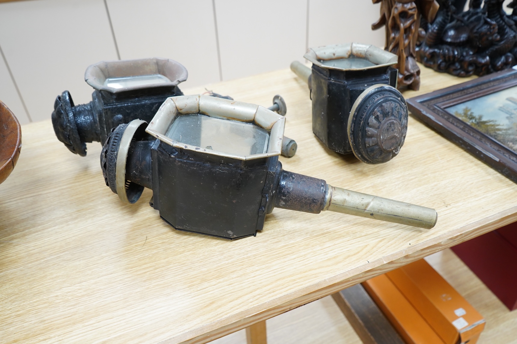 A pair of late 19th century carriage lamps and another
